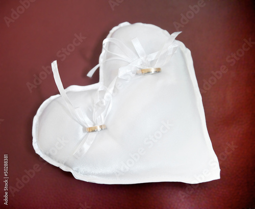 Photo: Wedding Rings on a Heart Shaped Pad Wedding Rings on a Heart Shaped Pad