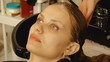 Beautiful young woman getting a hair washed at a hair salon.
