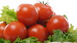 ripe tomatoes with lettuce and pepper on a white background