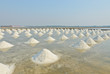 Sea salt piles in evaporation pond, Thailand