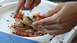 Peeling prawn with knife