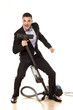 Young attractive businessman with a vacuum cleaner