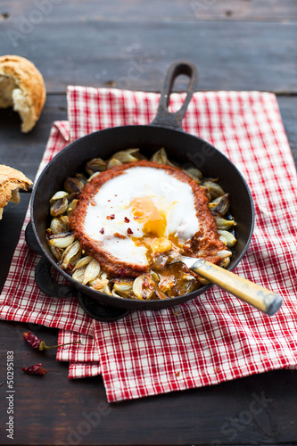 Photo: Egg baked with tomato purée and onions Egg baked with tomato purée and onions