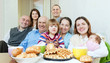 happy multigeneration family or group of friends