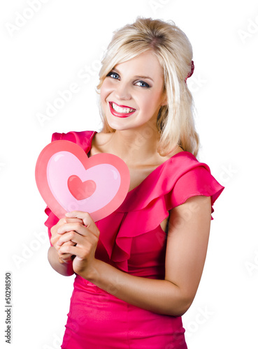 Photo: Woman holding a pink heart-shape Woman holding a pink heart-shape