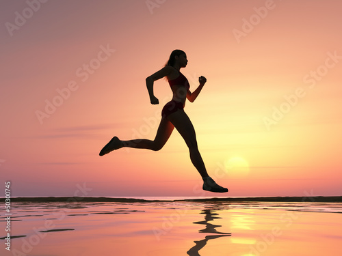 Photo: Woman running on the beach Woman running on the beach