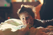 child from sleep lying on the sofa and enjoying life