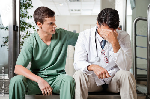 Photo: Colleague Comforting Upset Doctor Colleague Comforting Upset Doctor