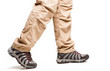 Hiker's legs in move at white background
