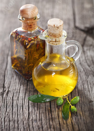 Photo: Olive oil and olive branch Olive oil and olive branch