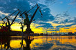 Photo: Monumental Cranes at sunset in Shipyard. Monumental Cranes at sunset in Shipyard.