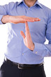 Businessman showing time out sign with hands.