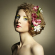 Beautiful young woman with delicate flowers in their hair