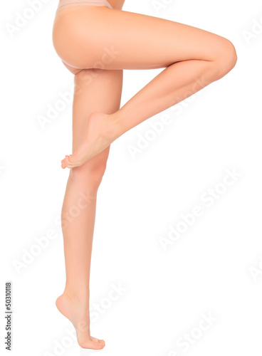 Photo: Perfect female legs, isolated on white background Perfect female legs, isolated on white background
