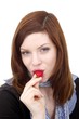 Foto: young beautiful woman with a strawberry (white background) young beautiful woman with a strawberry (white background)