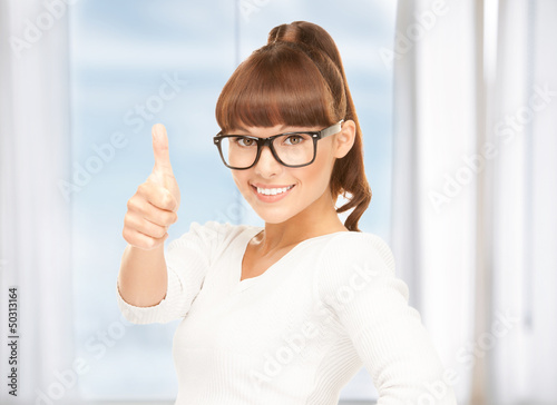 Photo: girl with thumbs up and glasses girl with thumbs up and glasses