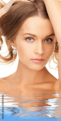 Photo: beautiful woman with long hair in water beautiful woman with long hair in water