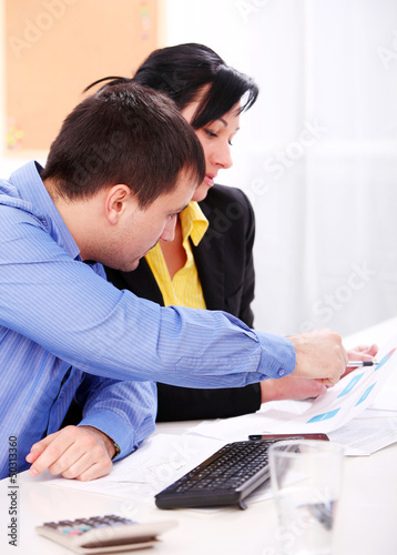 Photo: Business people working at office Business people working at office