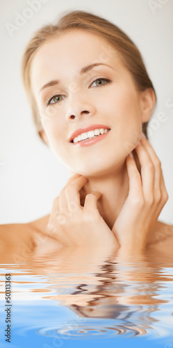 Photo: face and hands of beautiful woman in water face and hands of beautiful woman in water