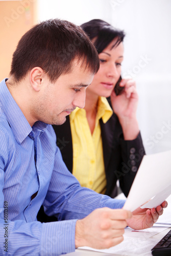 Photo: Business people working at office Business people working at office