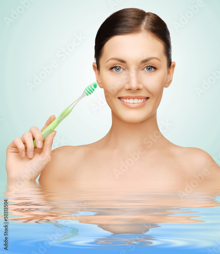 Photo: woman with toothbrush woman with toothbrush