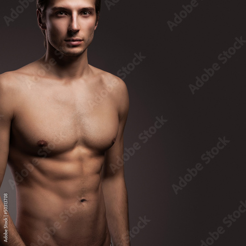 Photo: Handsome young man with naked torso Handsome young man with naked torso