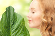 woman with green leaf