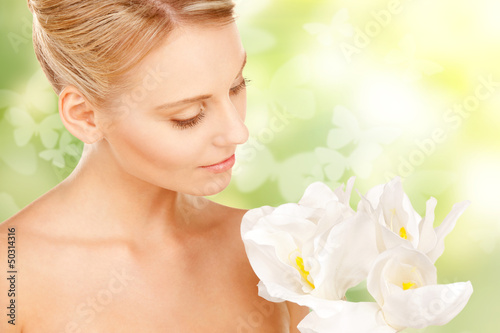 Photo: lovely woman with lily flower and butterflies lovely woman with lily flower and butterflies