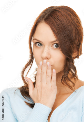 Photo: amazed woman with hand over mouth amazed woman with hand over mouth
