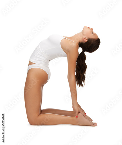 Photo: woman in cotton underwear doing exercises woman in cotton underwear doing exercises