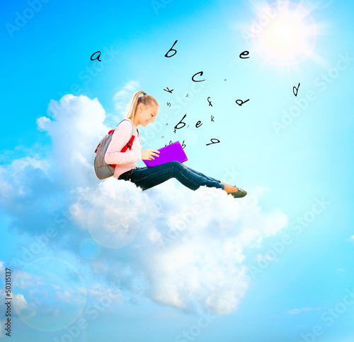 Photo: School Girl or Student on a Cloud Reading a book. Education School Girl or Student on a Cloud Reading a book. Education