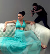 girl in a turquoise dress lying on sofa