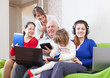 family  with laptops  at home