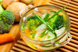 Vegetable soup and ingredients on a table