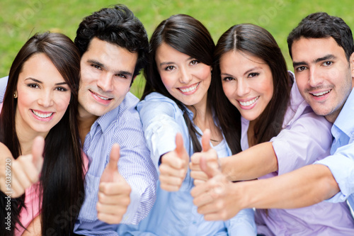 Photo: Group of friends with thumbs up Group of friends with thumbs up