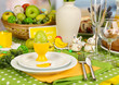 Serving Easter table on room background
