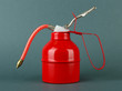Red oil can, on color background