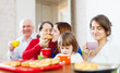 family having tea with cakes