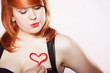 happy redhair girl with heart love symbol