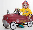 Cute blond jewish toddler boy playing pretend