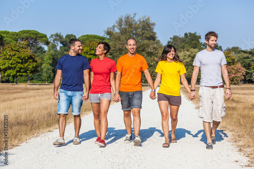 Photo: Group of Friends Walking Outside Group of Friends Walking Outside