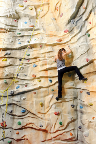 Photo: woman on rock wal woman on rock wal