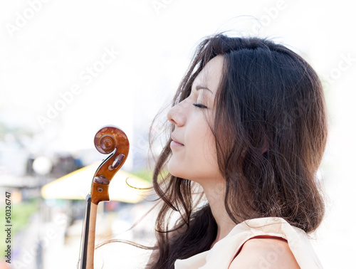 Photo: Girl and violin. Outdoors. Girl and violin. Outdoors.