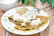 crepes with spinach with yogurt sauce and nuts