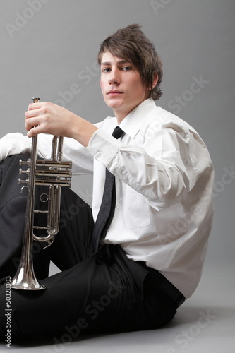 Photo: Portrait of a young man and his Trumpet Portrait of a young man and his Trumpet