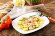 Tortellini with tomato, ham and cream