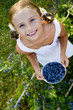 Blueberries - Lovely girl with fresh blueberries in the garden