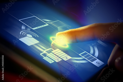 Photo: Closeup of finger touching tablet-pc screen Closeup of finger touching tablet-pc screen