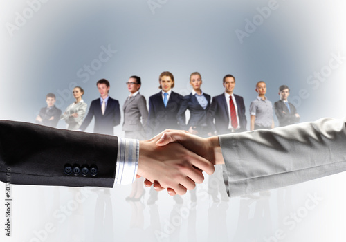 Photo: image of business handshake image of business handshake