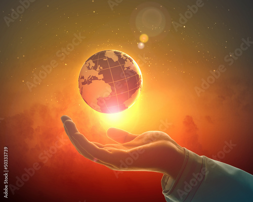 Photo: Image of earth planet on hand Image of earth planet on hand